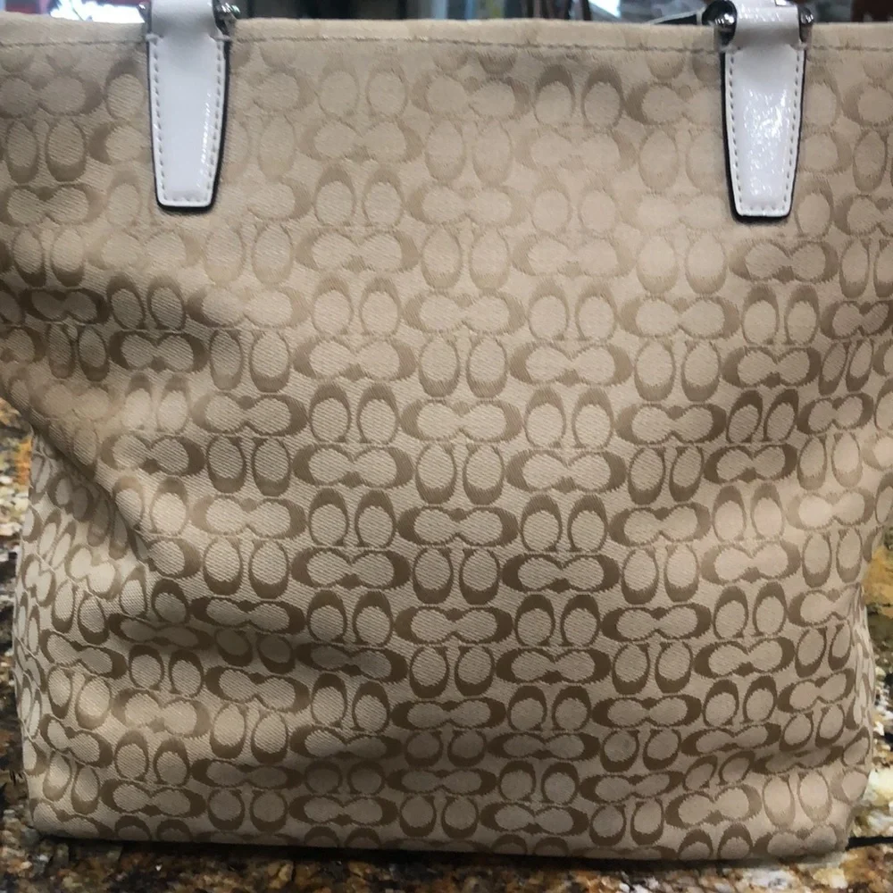 Coach Signature Cloth bag in beige with cream trim and handles.